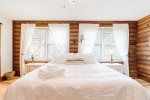 So much natural light in this master suite bedroom 
